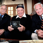 Terry Miller (left), Executive Director of the Tin Can Sailors Association (TCS), presents Lifetime Achievement Award to former destroyerman and Academy Award winner, the late Ernest Borgnine (center), at his home with TCS member John Gobbell (right) looking on.