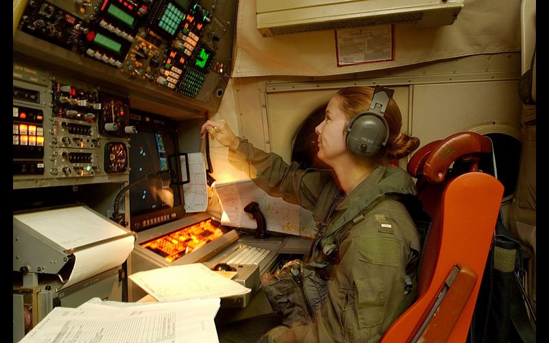 US_Navy_030509-N-6501M-018_Lt._j.g._Karensa_L._Heidmiller_operates_the_navigation_station_aboard_a_P-3C_Orion_aircraft_during_a_mission_to_the_Republic_of_the_Philip